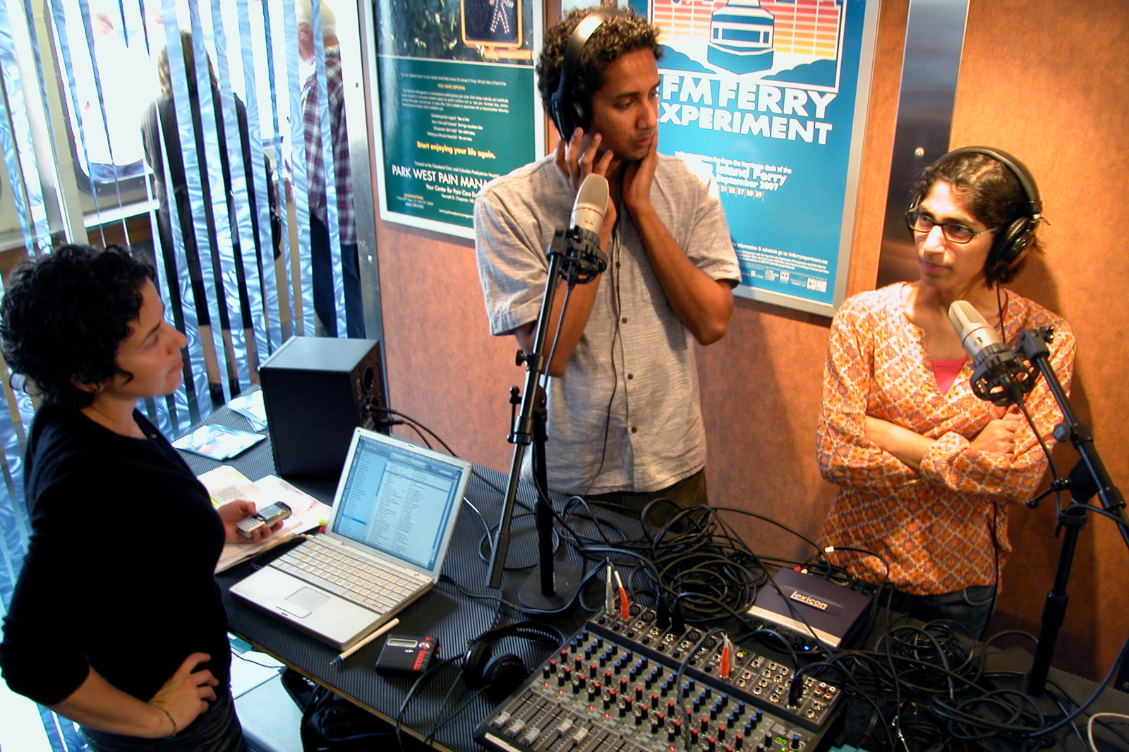 The FM Ferry Experiment studio on the John J. Marchi Staten Island Ferry. Image features (left to right) Valerie Tevere of neuroTransmitter and  on-air guests – Shreshta Premnath and Jesal Kapadia.